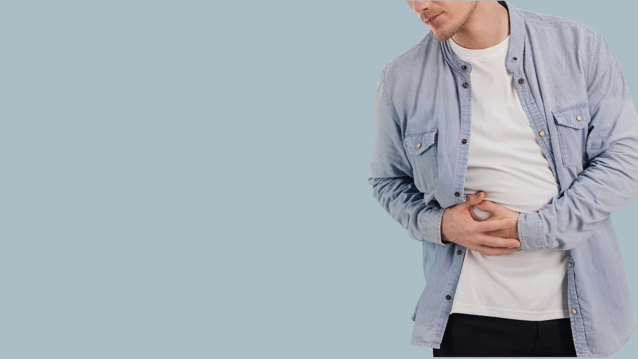 Man suffering from abdominal pain due to Inflammatory Bowel Diseases