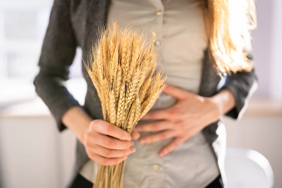 A woman with Celiac disease carrying wheat